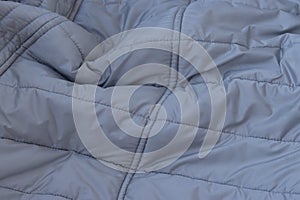 Texture concept - close up of crumpled gray silver fabric background