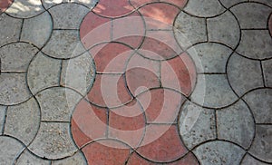 Texture of concrete pavement or sidewalk with paving slabs, top view. Blocks of the sidewalk pattern, details of the stone-tiled