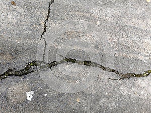 Texture of cracked macadam asphalt for design, background or wallpaper