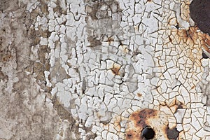 Texture of cracked white paint on metall surface