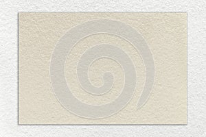 Texture of craft beige paper background with white border, macro. Structure of vintage cardboard with empty cream frame