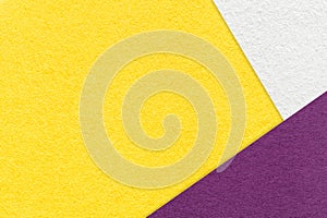 Texture of craft bright yellow color paper background with white and violet border. Vintage abstract cardboard