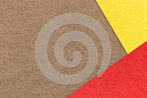 Texture of craft brown paper background with yellow and red border. Vintage abstract umber cardboard