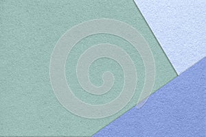 Texture of craft green color paper background with blue and very peri border. Vintage abstract mint cardboard