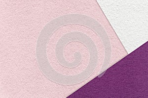 Texture of craft light pink color paper background with white and purple border. Vintage abstract rose cardboard