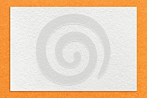 Texture of craft white color paper background with orange border, macro. Structure of vintage kraft cardboard