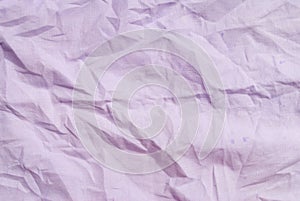 The texture of crumpled fabric is entirely lilac