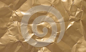 Texture of a crumpled sheet of yellow paper