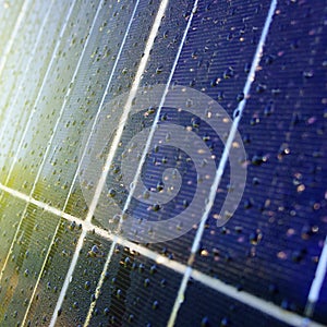 Texture of dark blue solar panel with water drops