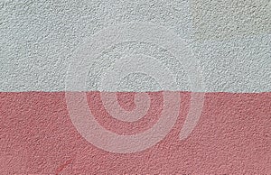 Texture of the decorative plasterwork painted in pink and white colors