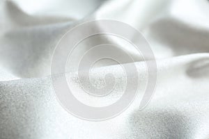 Texture of delicate white fabric as background