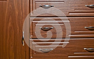 Texture of the door of a wooden bedside table.