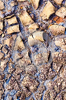 Texture of dry and cracked earth on the banks of the Rio tinto