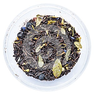 Texture of dry herbal tea with berries and leaves of blueberries and cranberries, closeup ingredient drink abstraction on a white