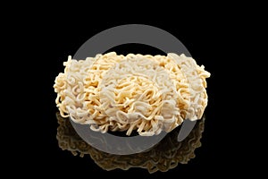 Texture of dry instant noodles isolated on black background. Raw dried Instant ramen noodles block isolated