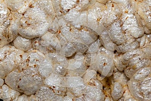 A texture of dry round cereal cakes close-up