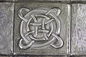 Texture with embossed drawing on tin foil