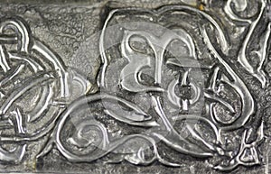 Texture with embossed drawing on tin foil