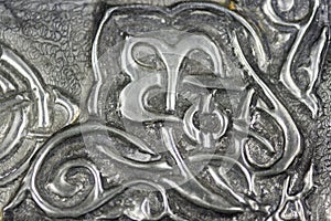 Texture with embossed drawing on tin foil