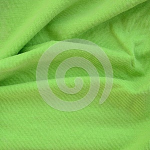 The texture of the fabric is bright green. Material for making s