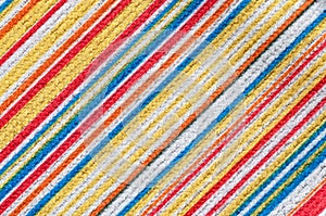 Texture of fabric with colorful diagonal stripes pattern.