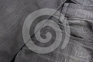 Texture of fabric of gray jeans close-up.