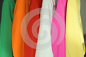 The texture of the fabric of the jackets is red, light green, yellow, white, pink