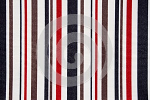 The texture of the fabric in multi-colored stripes.