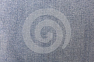 The texture of the fabric of worn jeans. High resolution photo