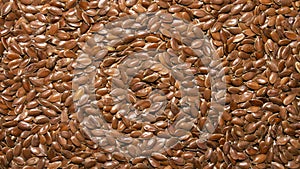 Flax grains background.The texture of flax grains is a top view.
