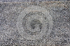 Texture of a fleecy dark gray carpet