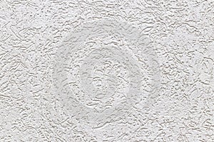 Texture of a fragment of a wall of a modern structure of white color. Harshness in the style of bark beetle.A background for desig