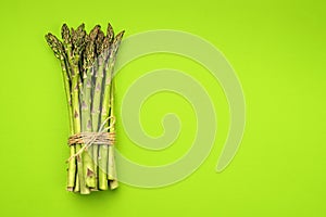 Texture of fresh green asparagus, top view.