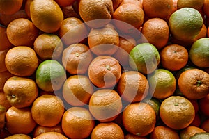 Texture of fresh mandarin oranges in supermarket, citrus fruit photo