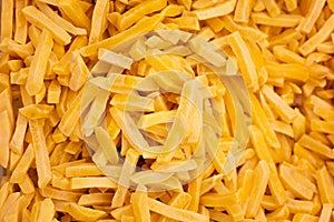 texture of frozen French fries, sliced potatoes. Food background for your unique text