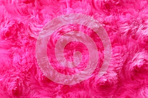 Texture of fuzzy pink fabric as background