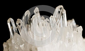 Texture of gemstone clear rhinestone closeup as a part of cluster geode filled with rock Quartz crystals.