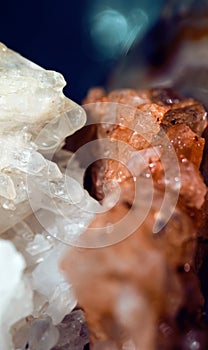 Texture of gemstone pink Fluorite closeup as a part of cluster geode filled with rock Quartz crystals.