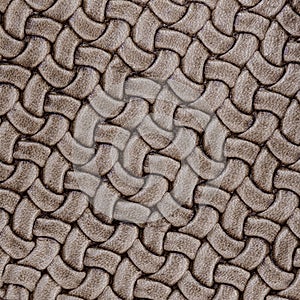 Texture of genuine Braided leather. Fashion trend leather background, copy space, substrate composition use