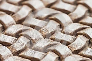Texture of genuine brown wicker leather close-up photo