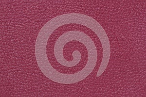 Texture of genuine leather close-up, fashion shade of burgundy red color, matte surface, trendy background