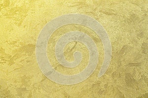 Texture of golden decorative plaster or concrete. Abstract gold grunge background.