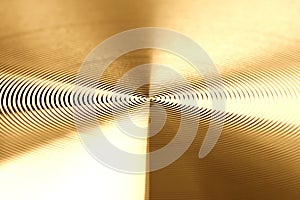 Texture of golden metal. Round metal texture. Metal texture background. Extrem close-up photo