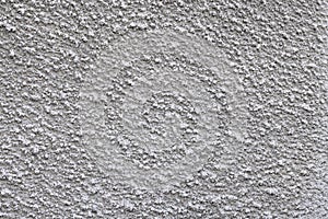 Texture of a gray cement wall with a pimply coating