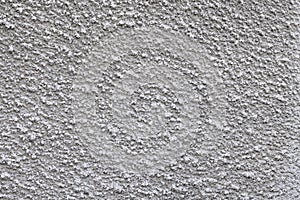 Texture of a gray cement wall with a pimply coating photo