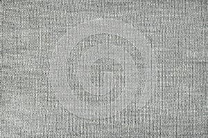 Texture of gray knitted fabric, close-up, top view