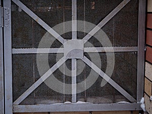 Texture of a gray metal grate with various elements