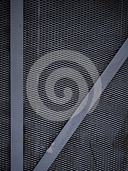 Texture of a gray metal grate with various elements