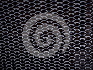 Texture of a gray metal grate with various elements