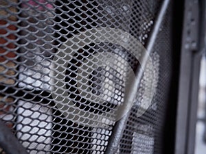 Texture of a gray metal grate with various elements